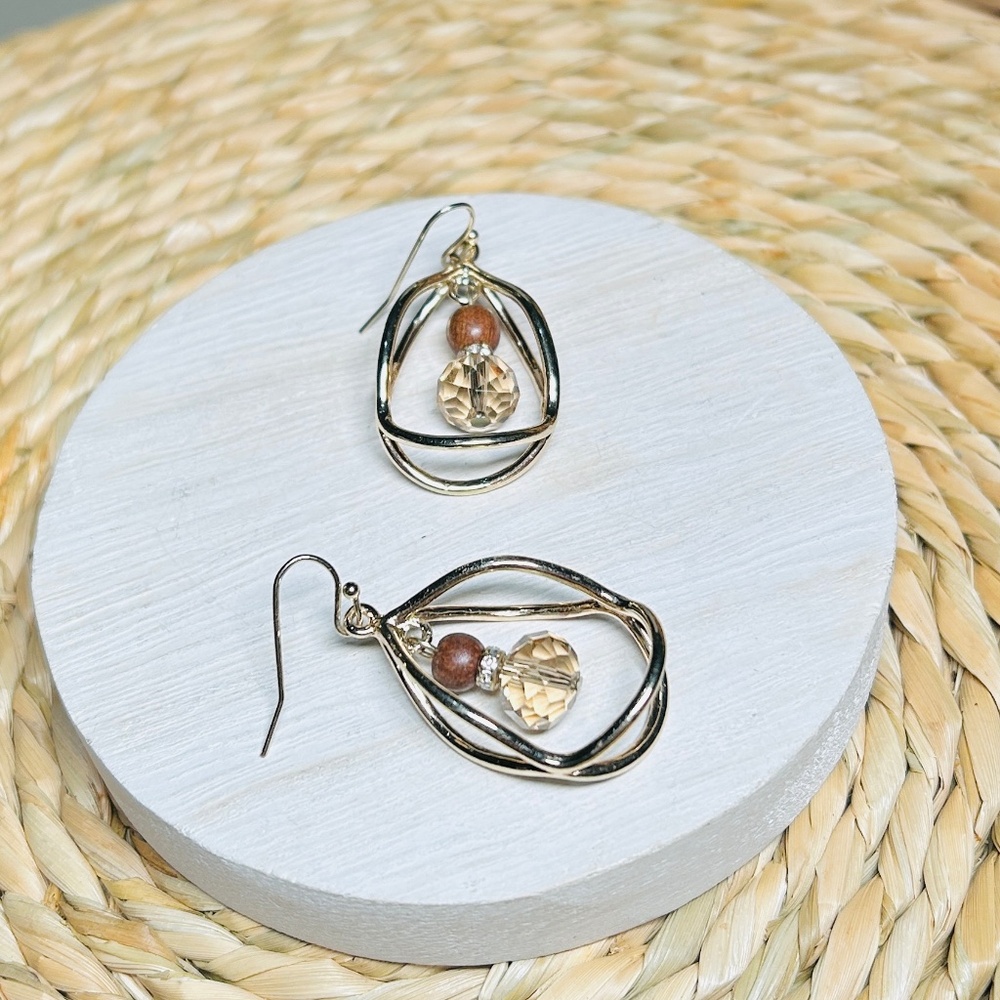 Gold Oval Teardrops surround the beautiful wooden beads, drop earrings